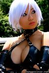  airbrushed asian breasts buckle_straps christie christie_(doa) cleavage collar cosplay criss-criss_top criss_cross_top dead_or_alive earrings elbow_gloves gloves hoop_earrings jewelry large_breasts latex photo real strap straps tecmo vinyl white_hair yaya_han 