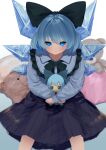  1girl :/ absurdres alternate_costume bangs black_bow black_bowtie blue_bow blue_eyes blue_hair blush bow bowtie character_doll cirno closed_mouth crossed_wrists doll expressionless feet_out_of_frame frilled_shirt_collar frills from_above fumo_(doll) hair_bow highres holding holding_doll ice ice_wings kiyonetto looking_at_viewer pillow pleated_skirt short_hair simple_background sitting skirt solo stuffed_animal stuffed_toy sweater teddy_bear touhou upturned_eyes white_background wings 