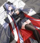 1girl august_von_parseval_(azur_lane) azur_lane between_breasts black_dress black_hair black_horns black_thighhighs blue_eyes breasts curled_horns detached_sleeves dress feet_out_of_frame gloves hair_over_one_eye highres horns large_breasts long_hair lying on_bed one_eye_covered qing_wu sleeves_past_wrists solo thighhighs two-tone_coat very_long_hair white_gloves 