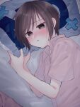  1girl absurdres baby_(demotsu) bangs bed_sheet blush brown_eyes brown_hair closed_mouth embarrassed fruits_basket hands_up highres looking_at_viewer lying no on_bed on_side pillow pout short_hair short_sleeves solo souma_akito upper_body yes-no_pillow 