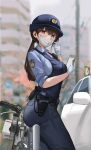  1girl ass black_hair blue_headwear blue_pants blue_shirt blue_vest blurry blurry_background breasts earphones gloves gun handgun hat highres holster looking_at_viewer mask medium_breasts mouth_mask original outdoors pants police police_badge police_hat police_uniform policewoman ponytail sawkm shirt uniform vest weapon white_gloves white_mask 