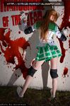  1girl against_wall ass blood brown_hair cosplay elbow_pads elbowpads fingerless_gloves from_behind gloves highschool_of_the_dead knee-pads knee_pads long_hair miyamoto_rei photo plaid plaid_skirt pleated_skirt real school_uniform serafuku skirt solo standing zombie 