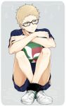  1boy blonde_hair brown_eyes full_body glasses haikyuu!! karasuno_volleyball_uniform knee_pads knees_to_chest male_focus shoes short_hair shorts sitting solo sportswear tsukishima_kei volleyball volleyball_uniform wai white_footwear 