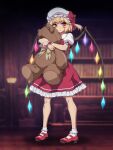  1girl blonde_hair blurry blurry_background closed_mouth commentary_request crystal flandre_scarlet full_body hat highres library mob_cap ootsuki_wataru puffy_short_sleeves puffy_sleeves red_eyes red_footwear red_skirt shoes short_hair short_sleeves side_ponytail skirt socks solo standing stuffed_animal stuffed_toy teddy_bear touhou twitter_username white_headwear white_socks wings wrist_cuffs 