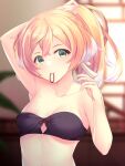  1girl arm_up bandeau bangs bare_arms bare_shoulders blurry blurry_background breasts commentary genshin_impact green_eyes hair_tie_in_mouth hand_up highres long_hair looking_at_viewer midriff mouth_hold pink_hair small_breasts solo stomach strapless tube_top upper_body yanfei_(genshin_impact) zenzai_tarou 