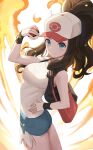  1girl absurdres ass bag bare_arms baseball_cap black_vest blue_eyes breasts brown_hair closed_mouth denim denim_shorts dot_nose fire from_side hand_on_hip hand_up handbag hat high_ponytail highres hilda_(pokemon) holding holding_poke_ball long_hair looking_at_viewer looking_to_the_side medium_breasts poke_ball poke_ball_(basic) poke_ball_print pokemon pokemon_(game) pokemon_bw print_headwear rinrasetsu short_shorts shorts sidelocks smile solo tank_top thighs v-shaped_eyebrows vest white_tank_top wristband 