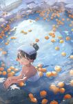  1girl bangs bare_shoulders black_hair blue_eyes blue_sky blush breasts clear_sky cleavage day fence food from_above fruit full-face_blush hair_bun highres looking_at_viewer medium_breasts mountainous_horizon naked_towel onsen open_mouth original outdoors potg_(piotegu) ripples sidelocks sky smile snow solo standing towel towel_on_head tree upper_body water winter yuzu_(fruit) yuzu_bath 