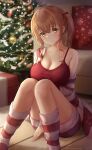  1girl absurdres amano_kusatsu bare_shoulders between_legs bow box breasts brown_hair camisole cardigan christmas christmas_tree cleavage closed_mouth feet_out_of_frame gift gift_box hair_bow hand_between_legs highres knees_together_feet_apart large_breasts looking_at_viewer off_shoulder open_cardigan open_clothes original red_bow red_camisole short_twintails sitting smile socks striped striped_cardigan striped_socks twintails twitter_username yellow_eyes 