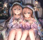  2girls absurdres bare_legs blush brown_hair christmas christmas_ornaments christmas_tree commentary controller game_controller happy_birthday highres idolmaster idolmaster_shiny_colors multiple_girls nemu_kotatsu night osaki_amana osaki_tenka pajamas playing_games siblings sisters sitting twins 