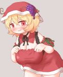  1girl aki_minoriko arinu blonde_hair blush breasts cleavage cowboy_shot fruit_hat_ornament grape_hat_ornament grey_background hair_between_eyes hat hat_ornament highres large_breasts open_mouth red_eyes red_headwear santa_costume short_hair short_sleeves simple_background solo touhou 