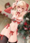  1girl absurdres arms_up asagiri_ai bikini black_thighhighs blonde_hair blurry blurry_background breasts christmas christmas_tree elbow_gloves fingerless_gloves flower genshin_impact gloves hair_flower hair_ornament hair_ribbon highres indoors large_breasts lumine_(genshin_impact) navel open_mouth orange_eyes pearl_thong ribbon santa_bikini short_hair_with_long_locks sidelocks stomach swimsuit thighhighs white_flower wreath 