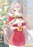  1girl blush breasts capelet christmas christmas_tree cleavage commentary_request dress eyes_visible_through_hair hair_over_one_eye highres indoors large_breasts long_hair looking_at_viewer original red_capelet red_dress red_eyes restrained ringozaka_mariko shiny shiny_hair solo white_hair window 