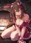  1girl admire_vega_(umamusume) animal_ears bell breasts brown_hair christmas cleavage ear_covers hair_between_eyes highres horse_ears horse_girl horse_tail indoors large_breasts long_hair looking_at_viewer neck_bell purple_eyes red_skirt single_ear_cover sitting skirt solo starheart tail thighhighs thighs umamusume white_thighhighs 
