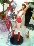  brown_hair figure long_hair lowres photo santa santa_costume ultraman 