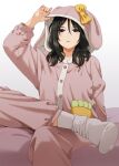  1girl animal_hood artist_name black_hair blue_eyes bunny_pajamas hair_between_eyes hood leg_up mattaku_mousuke medium_hair mole mole_under_eye on_bed open_mouth original pajamas rabbit_hood sitting socks solo watermark 