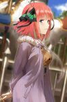  1girl amusement_park arms_behind_back bangs blue_eyes blunt_bangs blush breasts brown_shirt butterfly_hair_ornament carousel coat fagi_(kakikaki) from_side go-toubun_no_hanayome hair_ornament highres holding large_breasts long_sleeves looking_at_viewer looking_to_the_side nakano_nino one_side_up open_clothes open_coat parted_lips pink_hair purple_coat shirt short_hair smile solo upper_body 
