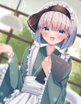  1girl alternate_costume apron bangs black_ribbon blue_eyes blunt_bangs blush enmaided fingernails frilled_apron frilled_ribbon frilled_sleeves frills furrowed_brow green_kimono grey_hair hair_ribbon hand_up highres holding holding_menu indoors japanese_clothes kimono konpaku_youmu lamp long_sleeves looking_at_viewer maid maid_headdress medium_hair menu open_mouth otowa_(otoha4634) ribbon sash smile solo standing sunlight touhou tree wa_maid white_apron white_sash wide_sleeves window 