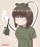  1girl brown_background brown_hair claymore_(mine) commentary ebifly explosive freckles green_shirt grin holding medium_hair mine_(weapon) original outline personification sanpaku shirt short_sleeves smile solo too_literal translated twitter_username upper_body 