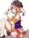  1girl alternate_costume animal_ears bangs blonde_hair brown_headwear cabbie_hat closed_mouth eating floppy_ears food hat highres holding holding_food japanese_clothes kimono knees_up looking_at_viewer orange_kimono orchid_(orukido) rabbit_ears red_eyes ringo_(touhou) sash short_hair simple_background smile solo touhou white_background 