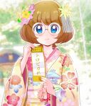  1girl bangs blue_eyes blurry blurry_background bob_cut brown_hair closed_mouth commentary day depth_of_field floral_print flower frown furisode glasses hair_flower hair_ornament hatsumoude holding holding_paper ichinose_minori japanese_clothes kimono long_sleeves looking_at_viewer mitumi_mira new_year omikuji outdoors paper precure print_kimono round_eyewear short_hair solo translated tropical-rouge!_precure upper_body yellow_kimono 