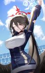  1girl :o arm_behind_head arm_up bangs black_choker black_hair black_wings blanc_(blanc97) blue_archive blue_jacket blue_sky blush breasts choker cloud commentary cowboy_shot day hair_between_eyes halo hasumi_(blue_archive) hasumi_(gym_uniform)_(blue_archive) high_ponytail highres jacket large_breasts long_hair looking_at_viewer official_alternate_costume one_eye_closed open_clothes open_jacket open_mouth outdoors outstretched_arm red_eyes shirt sidelocks sky solo standing stretching wall white_shirt wings 