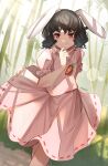  1girl animal_ears artist_name bamboo bamboo_forest black_hair carrot_necklace daweykun dress forest hand_on_own_chin highres inaba_tewi jewelry nature necklace outdoors pink_dress rabbit_ears red_eyes short_hair short_sleeves smile solo touhou 
