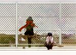  1boy 1girl alternate_costume black_hair black_pants black_sailor_collar black_serafuku black_socks blurry building chain-link_fence cityscape day enpera facing_viewer fading fence flying_teardrops from_behind full_body grey_sky kagerou_project kisaragi_shintarou loafers long_hair mekakucity_actors outdoors pants pecolatte power_lines red_scarf sailor_collar scarf school_uniform serafuku shirt shoes shoes_removed short_hair sitting socks standing tateyama_ayano town utility_pole white_shirt wide_shot wire_fence 