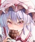  1girl absurdres blue_hair candy chocolate chocolate_bar collared_shirt eating food hat hat_ribbon highres looking_at_viewer maboroshi_mochi mob_cap pink_headwear pink_shirt portrait red_eyes red_ribbon remilia_scarlet ribbon shirt solo touhou white_background 