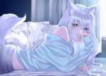  1girl absurdres animal_ear_fluff animal_ears blue_eyes blue_shirt blush cat_ears cat_girl cat_tail commentary_request curtains cushion grey_hair grey_pants highres indoors light_particles long_hair long_sleeves looking_at_viewer lying noripro off_shoulder on_bed on_stomach pants parted_lips shirayuki_mishiro shirt sleeves_past_wrists smile solo tail upper_body virtual_youtuber yuri_kyanon 