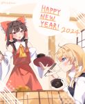  2024 2girls ascot blonde_hair blush bow bowl braid brown_hair chopsticks commentary_request detached_sleeves eating english_text food frilled_bow frilled_hair_tubes frills fruit hair_bow hair_tubes hakurei_reimu happy_new_year hidukihumi highres holding holding_bowl holding_chopsticks kirisame_marisa kotatsu long_hair long_sleeves mandarin_orange mochi mochi_trail multiple_girls no_headwear open_mouth red_bow red_eyes red_skirt side_braid single_braid sitting skirt skirt_set table touhou twitter_username under_kotatsu under_table white_bow yellow_ascot 