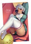  1girl absurdres arm_behind_head arm_up ass asticassia_school_uniform border breasts cellphone commentary_request couch dated foot_out_of_frame green_eyes green_jacket green_shorts grin gundam gundam_suisei_no_majo highres holding holding_phone jacket large_breasts legs_up looking_at_phone lying no_shoes on_back phone qblade school_uniform secelia_dote short_hair short_shorts shorts signature smartphone smile solo teeth thick_thighs thighhighs thighs white_border white_hair white_thighhighs 