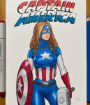  1girl art_tools_in_frame ass_visible_through_thighs breasts brown_hair captain_america captain_america&#039;s_shield captain_america_(series) commentary commission cowboy_shot english_commentary hammer highres holding holding_hammer holding_shield large_breasts looking_afar marker_(medium) marvel mask mjolnir_(marvel) photo_(medium) pink_lips shield signature solo superhero_costume traditional_media will_jack yellow_eyes 