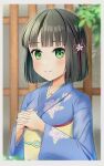  1girl black_hair blue_kimono blunt_bangs blunt_ends blurry blurry_background blurry_foreground blush border closed_mouth commentary depth_of_field floral_print_kimono flower flower_knot green_eyes hair_flower hair_ornament highres interlocked_fingers japanese_clothes kimono link!_like!_love_live! long_sleeves looking_at_viewer love_live! momose_ginko nanakussa obi official_alternate_costume own_hands_clasped own_hands_together sash short_hair smile solo split_mouth upper_body virtual_youtuber white_border wide_sleeves yellow_sash 