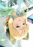  1girl animal_ear_headphones animal_ears bangs blonde_hair blue_archive bow cat_ear_headphones cellphone collared_shirt commentary_request fake_animal_ears gomennasai green_bow green_eyes green_necktie hair_bow halo headphones highres jacket medium_hair midori_(blue_archive) necktie open_mouth pen phone reflection reflective_table shirt smartphone smile solo swept_bangs upper_body upside-down white_shirt 