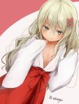  1girl akino_shuu blonde_hair blush bow closed_mouth collarbone grecale_(kancolle) green_eyes hair_bow hakama japanese_clothes kantai_collection long_hair long_sleeves miko pink_bow red_hakama smile solo twitter_username wide_sleeves 