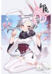  1girl absurdres animal animal_ears blue_archive blurry blurry_background blurry_foreground blush cherry_blossoms chinese_zodiac depth_of_field fake_animal_ears fake_tail falling_petals flower grin hair_bun hair_flower hair_ornament hairband happy_new_year highres japanese_clothes kimono looking_at_viewer mutsuki_(blue_archive) mutsuki_(new_year)_(blue_archive) nengajou new_year obi petals pink_flower pointy_ears purple_eyes rabbit rabbit_ears rabbit_girl rabbit_tail sak6ra sash seiza sitting smile tail thighhighs tree wariza white_kimono 