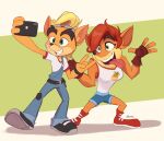  2021 activision anthro breasts brother brother_and_sister cellphone clothing coco_bandicoot crash_bandicoot crash_bandicoot_(series) crossgender duo female footwear ftm_crossgender hair hi_res holding_cellphone holding_object holding_phone magaska19 male mammal marsupial mtf_crossgender open_mouth open_smile phone pose selfie sibling signature sister smile tongue tongue_out 