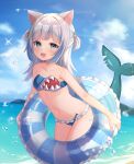  1girl absurdres adapted_costume animal_ears bangs beach bikini blue_bikini blue_eyes blue_hair blue_sky blunt_bangs breasts cat_ears cloud commentary_request day fish_tail gawr_gura grey_hair hair_ornament highres hololive hololive_english horizon innertube medium_hair multicolored_hair navel nekopurin_(nyanko_prin) ocean outdoors shark_girl shark_hair_ornament shark_tail sharp_teeth short_twintails sky small_breasts solo streaked_hair swimsuit tail teeth twintails two_side_up virtual_youtuber 