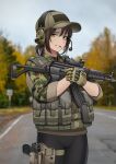  1girl absurdres ammunition_pouch assault_rifle bangs baseball_cap belt black_gloves black_pantyhose blurry blurry_background brown_gloves brown_hair brown_headwear camouflage camouflage_jacket cigarette collared_jacket cowboy_shot day digital_camouflage english_commentary folding_stock gloves green_eyes green_jacket gun hair_between_eyes handgun hat headset highres holding holding_gun holding_weapon holster holstered_weapon jacket kalashnikov_rifle keiita lips load_bearing_vest long_bangs looking_at_viewer microphone mixed-language_commentary mouth_hold optical_sight original outdoors pantyhose parted_lips pouch rifle road road_sign serbo-croatian_commentary short_hair sign sleeves_rolled_up smile smoking solo tactical_clothes teeth thigh_holster tree two-tone_gloves utility_belt weapon zastava_m21 