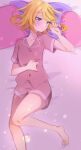  1girl bangs barefoot blonde_hair blue_eyes blush closed_mouth collarbone dress_shirt heart heart_pillow highres kagamine_rin kawahara_chisato lying medium_hair on_back pillow pink_shirt pink_shorts shirt short_shorts short_sleeves shorts solo swept_bangs vocaloid 