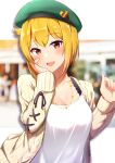  1girl argyle_cardigan beret blonde_hair blurry blurry_background blush breasts cleavage collarbone green_headwear hand_on_own_cheek hand_on_own_face hat heart heart_necklace highres ibuki_tsubasa idolmaster idolmaster_million_live! jewelry karua_(karua23) letterboxed looking_at_viewer medium_breasts necklace outdoors red_eyes shirt smile solo upper_body white_shirt 