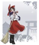  1girl adapted_costume black_eyes boots broom brown_hair chamaji commentary cross-laced_footwear dress full_body hair_ribbon hair_tubes hakurei_reimu highres holding holding_broom jitome long_sleeves medium_hair nontraditional_miko outdoors own_hands_together petticoat purple_scarf red_dress red_ribbon ribbon scarf solo standing torii touhou wide_sleeves winter 