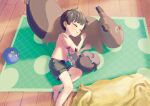  1boy ball bangs brown_hair character_doll closed_eyes commentary_request from_above green_shorts hands_up highres indoors kyu_kei lying male_focus on_side parted_lips pokemon pokemon_(creature) rug shirt short_hair short_sleeves shorts skwovet sleeping t-shirt wooden_floor 