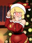  1girl absurdres alternate_costume bangs belt black_belt blonde_hair blush breasts christmas christmas_tree commentary_request covering_mouth cowboy_shot detached_sleeves dress fur-trimmed_dress fur-trimmed_sleeves fur_trim hat highres jewelry kurodani_yamame large_breasts looking_at_viewer open_mouth red_dress red_eyes red_headwear red_sleeves ribbon ring rinyamame santa_dress santa_hat short_hair solo strapless touhou yellow_ribbon 