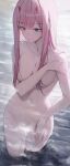  1girl bare_shoulders breasts closed_mouth collarbone completely_nude covered_pussy covering covering_breasts cowboy_shot darling_in_the_franxx gnns green_eyes hair_over_breasts hair_over_shoulder highres light_blush long_hair looking_down medium_breasts navel nude ocean pink_hair sidelocks solo standing sunlight wading zero_two_(darling_in_the_franxx) 