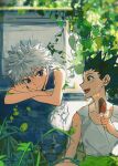  2boys :d bare_arms blue_eyes brown_eyes closed_mouth commentary_request crossed_arms day food gon_freecss highres holding holding_food holding_ice_cream hunter_x_hunter ice_cream killua_zoldyck leaf looking_at_another male_focus multiple_boys nature open_mouth outdoors popsicle shenshan_laolin short_hair shorts sitting sleeveless smile sweat tank_top white_hair white_tank_top 