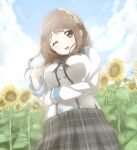  1girl beni_moyashi blue_sky blush breasts brown_eyes brown_hair cloud cloudy_sky ensemble_girls! flower highres kimisaki_school_uniform large_breasts long_hair long_sleeves looking_at_viewer one_eye_closed open_mouth plaid plaid_skirt school_uniform skirt sky smile solo sunflower yellow_flower yumeji_maria 