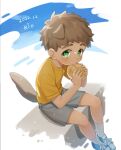  1boy animal_ears artist_name blue_eyes bread brown_hair child commentary commentary_request dated dog_boy dog_ears food highres kemonomimi_mode male_child male_focus mouth_hold original rio_mukiniki shirt short_hair shorts sitting solo tail white_background yellow_shirt 
