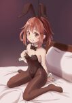  1girl animal_ears bed black_bow black_bowtie black_leotard black_pantyhose bow bowtie breasts brown_eyes brown_hair covered_navel detached_collar fake_animal_ears grin hair_ornament hairclip highres ikazuchi_(kancolle) kantai_collection leotard pantyhose pillow playboy_bunny rabbit_ears short_hair sitting small_breasts smile solo strapless strapless_leotard tetsuryuu wariza wrist_cuffs 