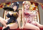  2girls bare_shoulders black_dress black_hair black_nails blonde_hair blue_eyes breasts bun_cover china_dress chinese_clothes cleavage cleavage_cutout clothing_cutout commentary_request covered_navel dress fan_hair_ornament figure_four_sitting floral_print hand_fan hand_up high_heels highres holding holding_fan holding_hands indoors lantern large_breasts long_hair looking_at_viewer multiple_girls nakajima_yuka open_mouth original paper_lantern red_eyes red_nails short_hair sitting sleeveless sleeveless_dress smile white_dress 